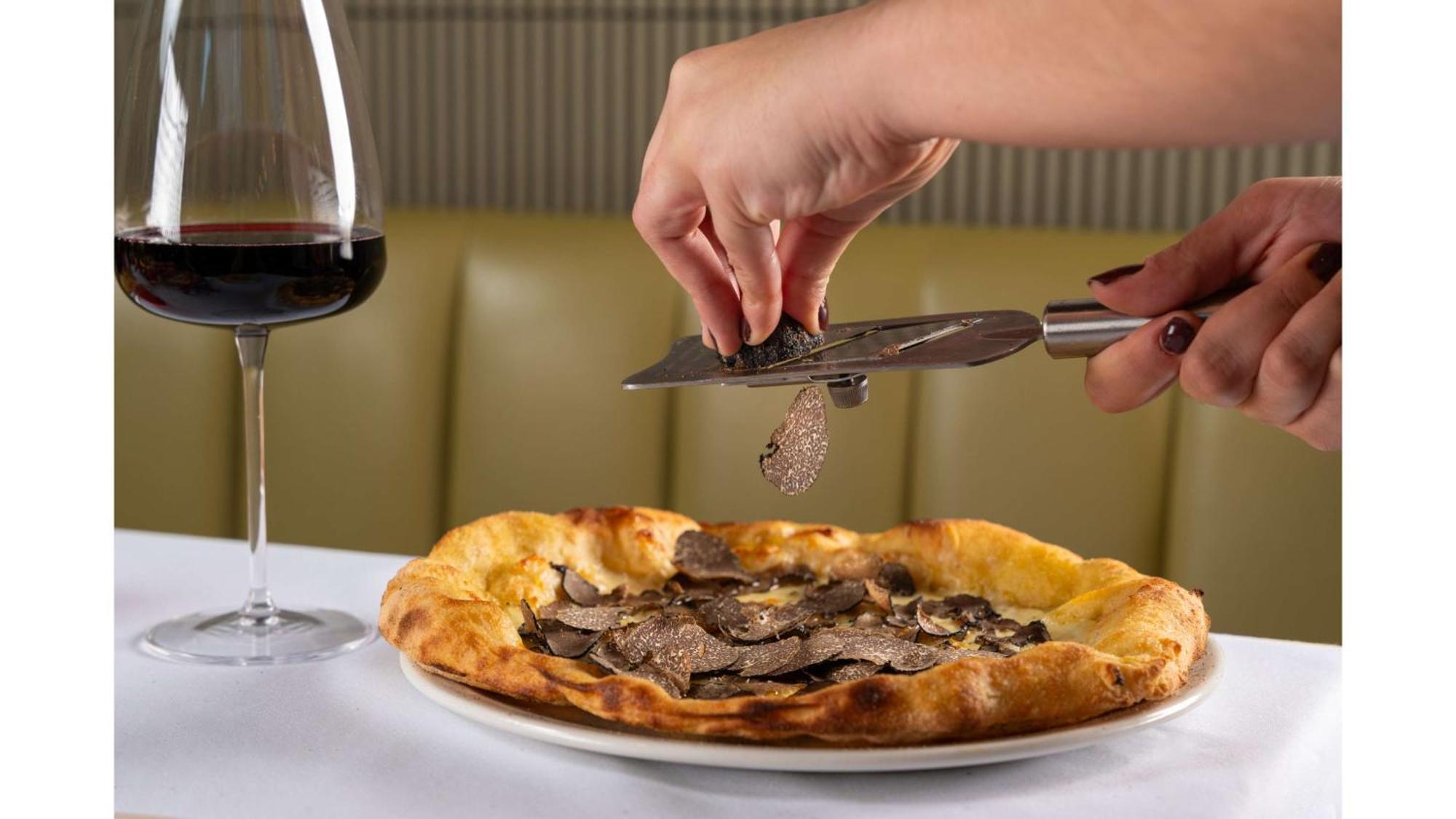 Art'Otel London Battersea Power Station, Powered By Radisson Hotels Buitenkant foto A truffle being shaved over a pizza